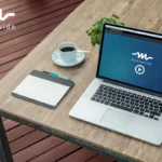 A Macbook on a desk displaying a personalized video from Mediawide
